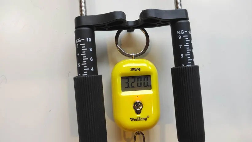Buyer photo: Epic Extender hooked to a hanging scale to check the tension reading